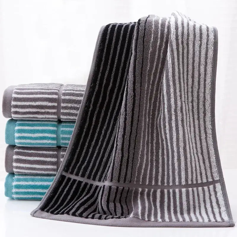 A british style sports fitness towel with turquoise gray stripes and soft terry cloth texture for gym use