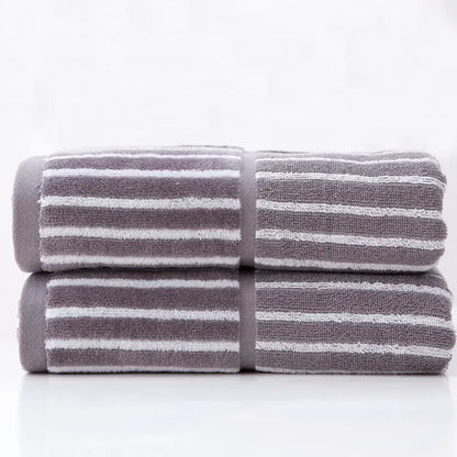 Stacked gray and white striped sports fitness towel with soft textured weave for gym and fitness use