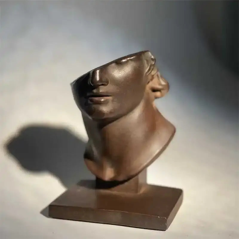 Bronze-colored abstract human face sculpture with smooth polished surface for living room decorbites art decor