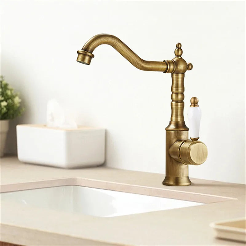 Antique brass bronze basin faucet with white ceramic handle and vintage design for cold water deck mounting