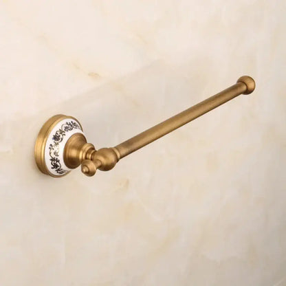 Antique brass towel rack with white ceramic base and black floral patterns from decorbites bronze bathroom hardware set