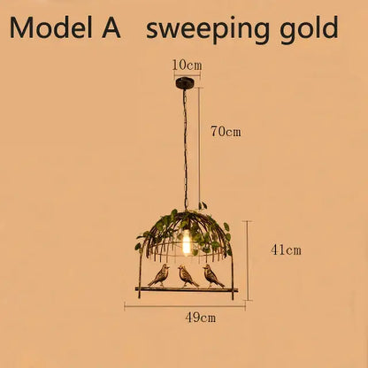 Bronze birdcage pendant lights with a sweeping gold design, three birds, and greenery garland for dining room decor