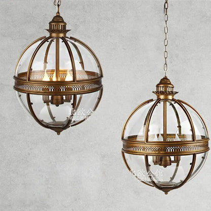 Bronze black glass globe chandelier foyer light featuring antique brass globe pendant lights with intricate metalwork and clear glass panels