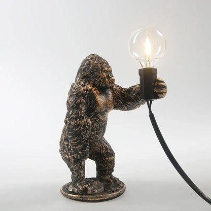 Bronze king kong gorilla table lamp with bronze finish holding a clear bulb for bedroom night light use
