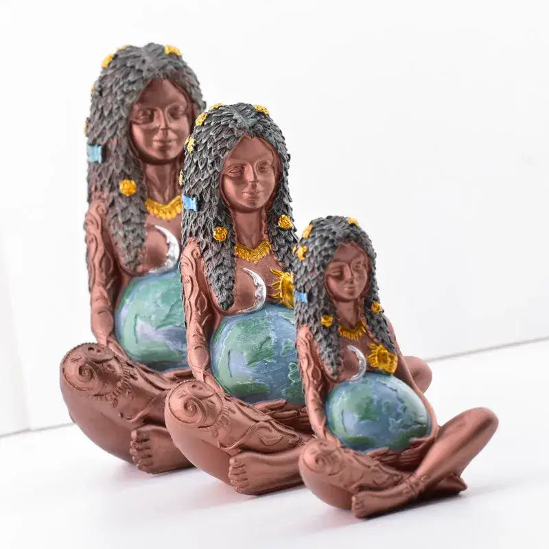 Three terracotta mother earth goddess figurines in yoga pose with gray hair and blue accents for living room decorbites gaia mother