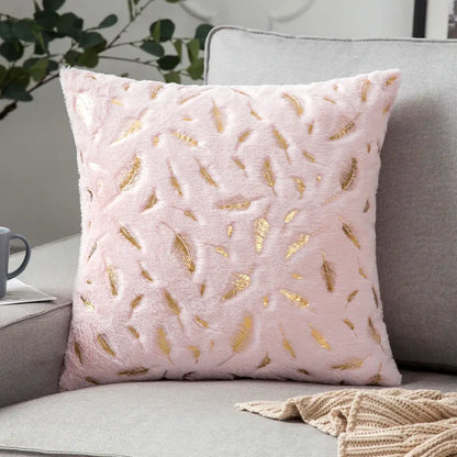 Pink plush throw pillow with bronzed feather style gold embroidery for elegant living room decor