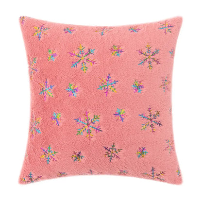 Pink fuzzy throw pillow with colorful sequined snowflake patterns featuring bronzed feather style decor accents