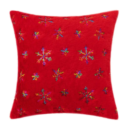 Red plush throw pillow with colorful sequined snowflake patterns featuring bronzed feather style design for living room decor