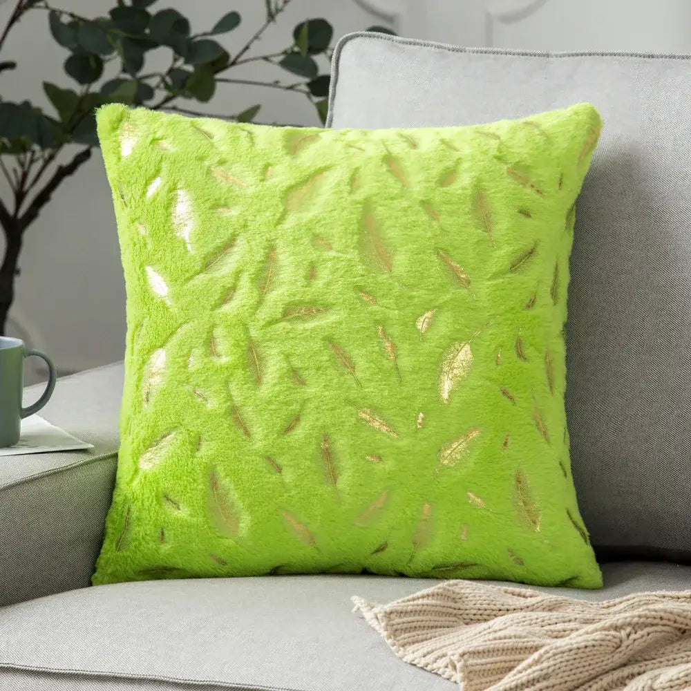 Vibrant lime green velvet throw pillow with bronzed feather style metallic gold appliques for living room decor