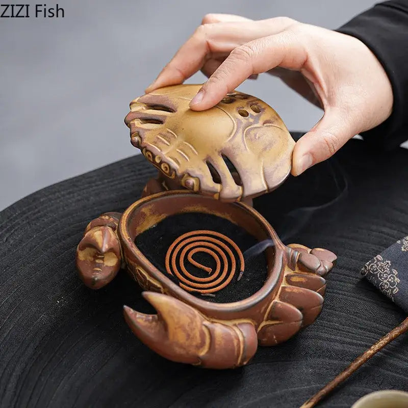 Brown and beige ceramic incense burner shaped like a crab with detailed carvings and spiral coil for living room aromatherapy
