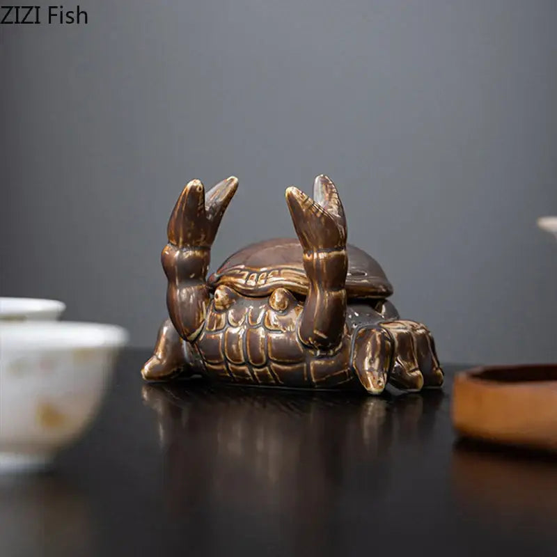 Brown glossy ceramic crab ashtray phone holder with detailed shell and claw textures for office decorbites crab ceramic decor