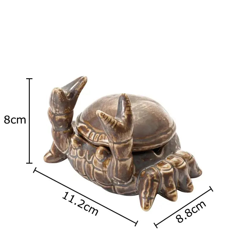 Brown decorbites crab ceramic ashtray and phone holder featuring detailed shell and claw design in brown ceramic
