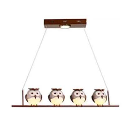 DecorBites owl metal pendant light with four gray and white owls and yellow led incandescent underbelly lighting