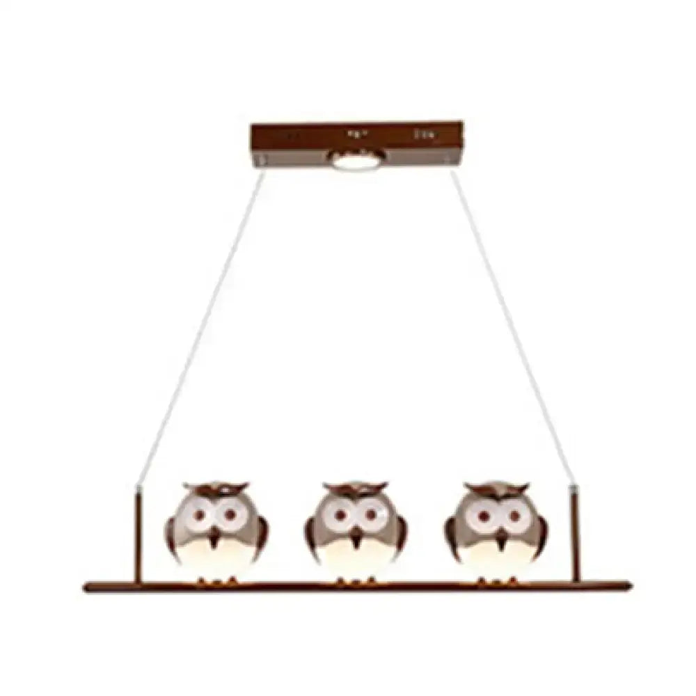 Decorbites owl metal pendant light featuring three brown cartoon owls on a bar with led incandescent fluorescent option
