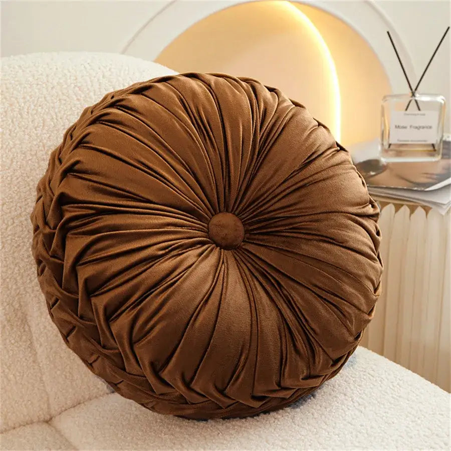 Brown pleated dutch velvet round seat cushion with gathered design and central button for living room seating
