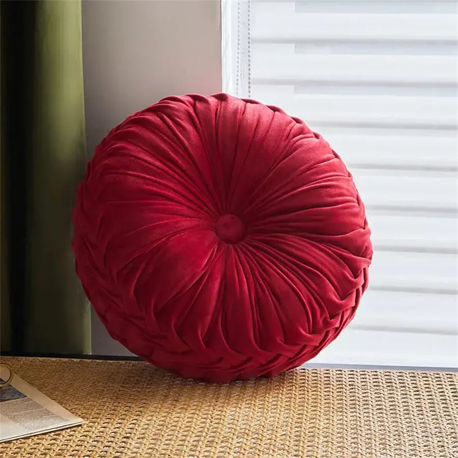 Brown pleated dutch velvet round seat cushion in deep red velvet with tufted center and gathered fabric ridges