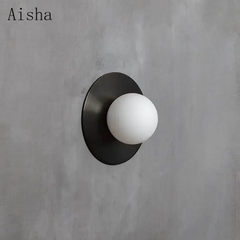Aisha brand minimalist wall lamp with matte black circular base and frosted glass bulb for decorbites circular wall lamp