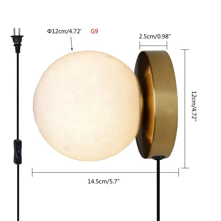 A sleek frosted glass wall lamp with a brushed brass base and black cord for decorbites circular planet wall lighting