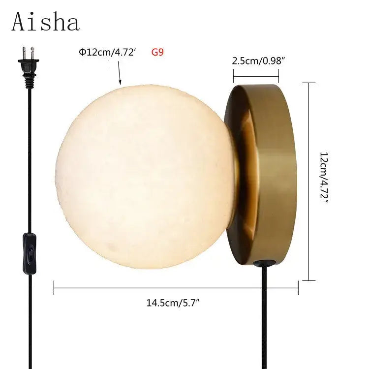 Aisha brand table lamp with frosted off-white spherical shade and brushed brass base in decorbites circular planet wall lamp style