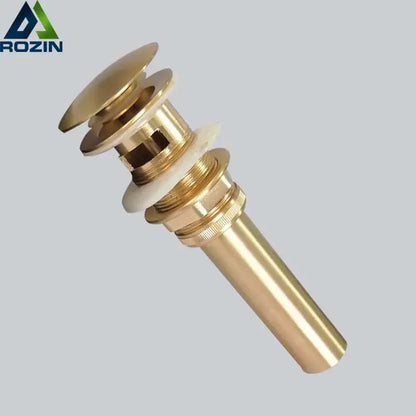 Brass-colored cylindrical brushed gold basin sink drain with flared top and threaded base from decorbites brushed gold collection