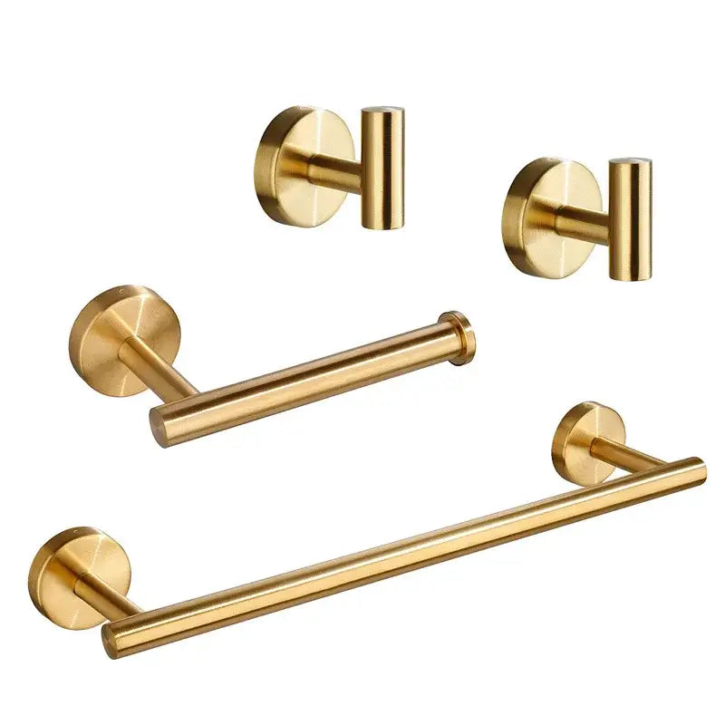 Set of brushed gold bathroom hardware set with towel bar, two wall-mounted hooks, and toilet paper holder