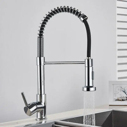 Brushed gold kitchen faucet with flexible spring hose and chrome finish featuring extendable spray head and coiled design
