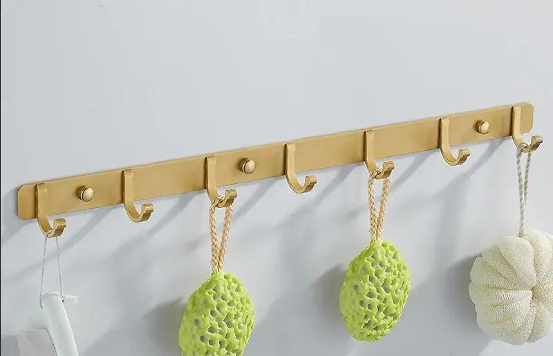 Brushed gold metal wall-mounted robe hooks rack with five hooks by decorbites for kitchen or bathroom organization