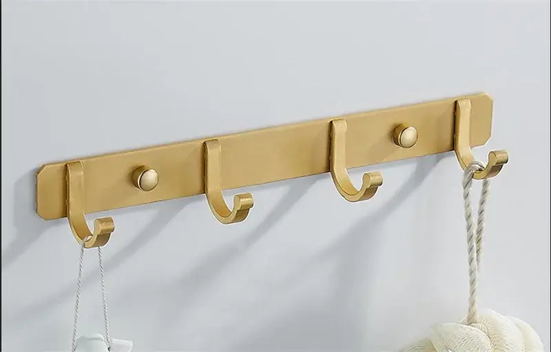 Gold-colored brushed metal robe hooks set with four round knobs for kitchen wall rack decorbites brushed gold finish