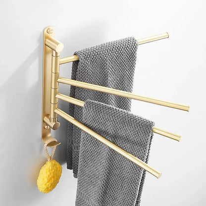 Brushed gold towel hanger with three extendable swivel arms holding gray textured towels decorbites brushed gold