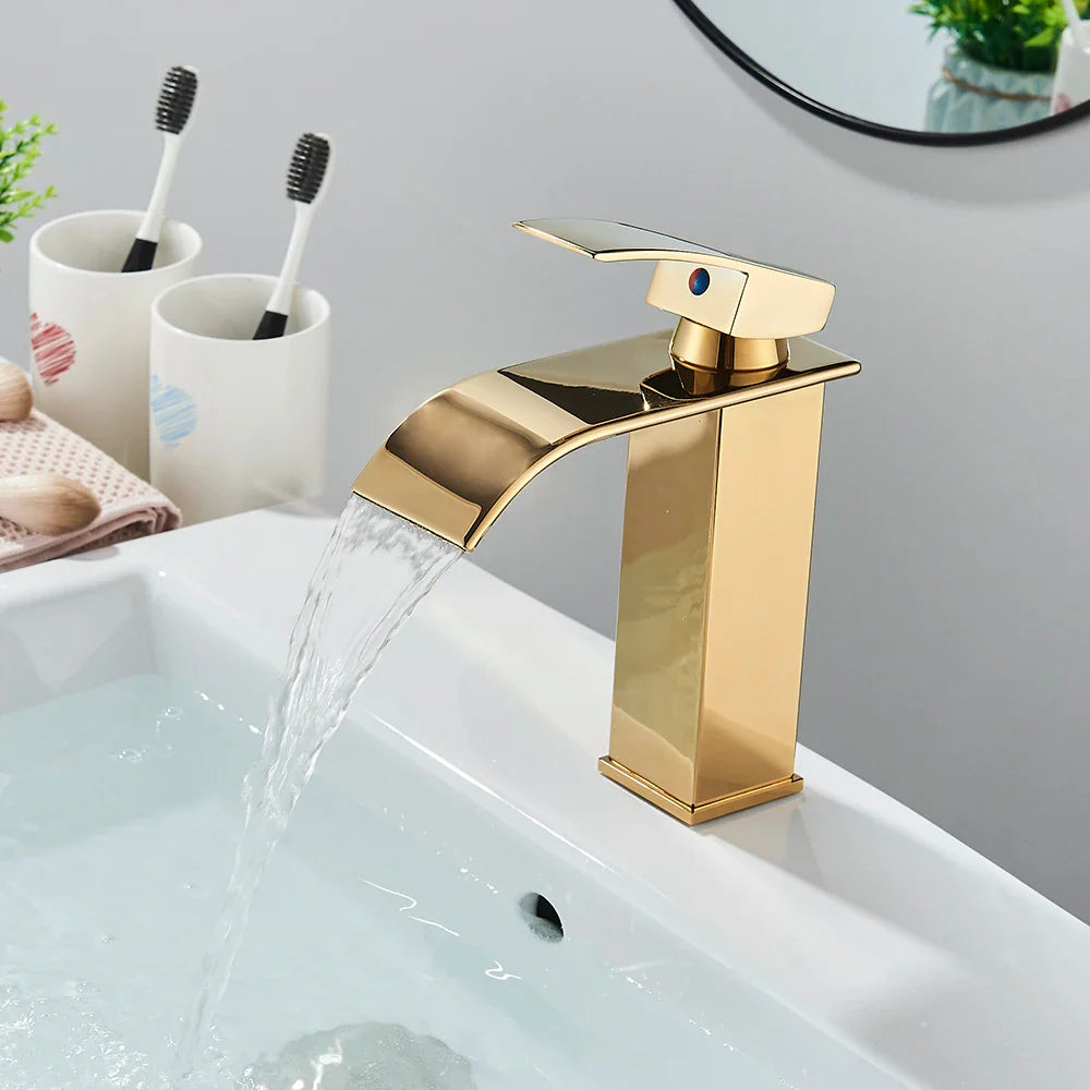 Brushed golden basin faucet single hole deck mount with a sleek gold-toned rectangular waterfall spout and brass mixer tap