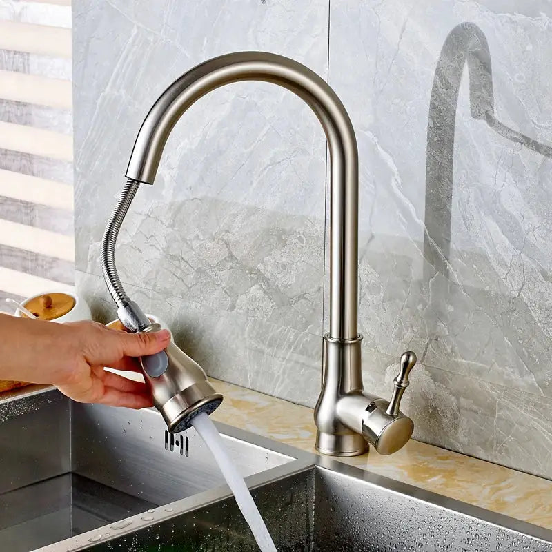 Brushed nickel pull out kitchen faucet with stainless steel curved spout and flexible spray head by DecorBites