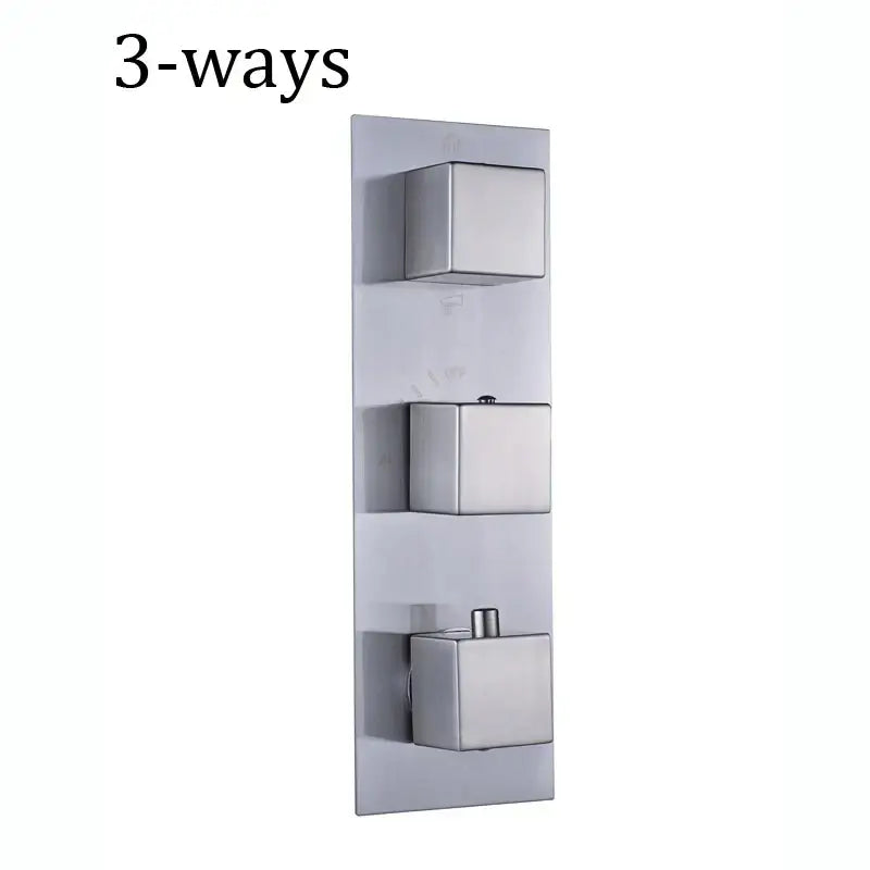 Modern brushed stainless steel thermostatic mixer valve with three square control knobs for bathroom shower control