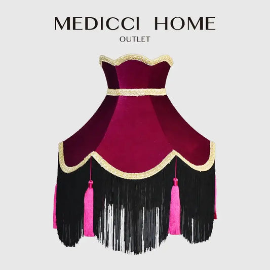 A burgundy wine red velvet scalloped lampshade with gold trim, black fringe, and pink tassels for living room use
