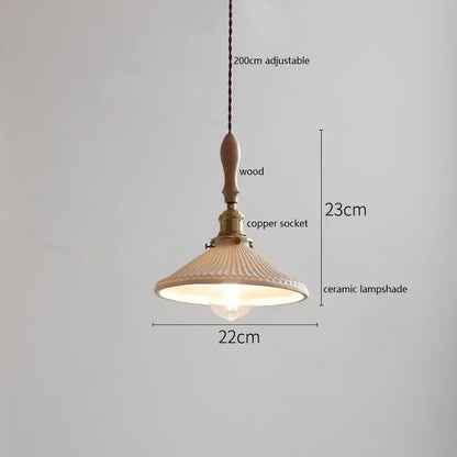 A warm-toned white fluted ceramic pendant lamp with a wooden finial and copper socket by decorbites butterfly ceramic