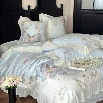 Light blue cotton bedding set with decorbites butterfly embroidery and soft lace ruffles for elegant bedroom decor