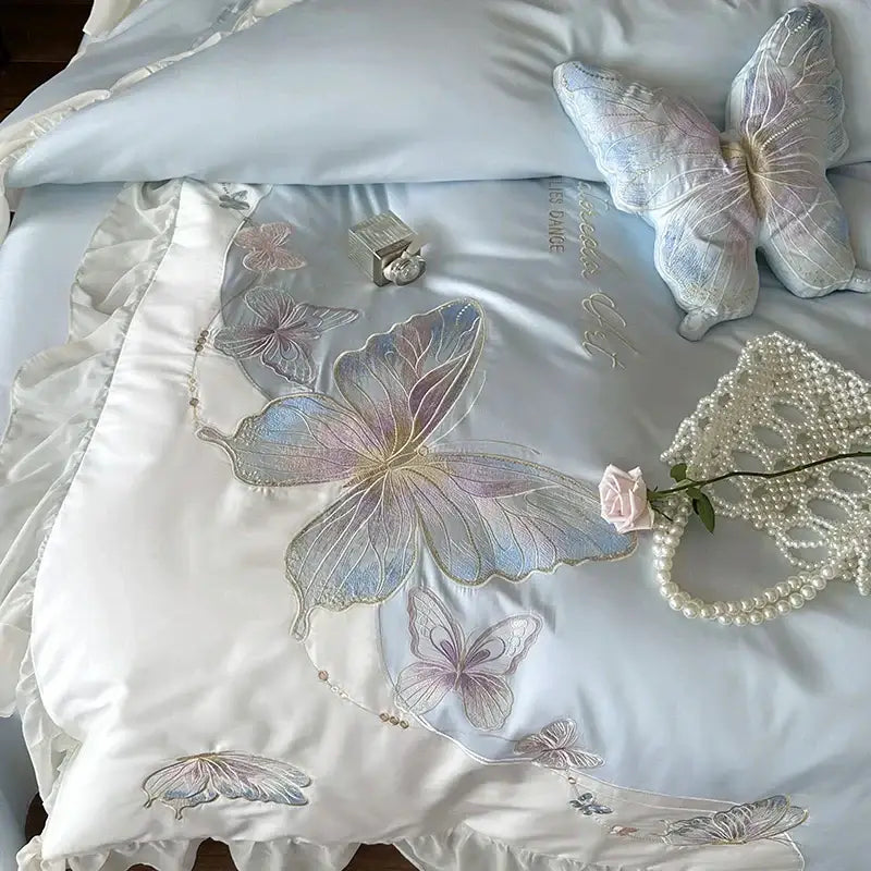 Light blue cotton bedding set featuring decorbites butterfly embroidery and lace ruffles for elegant bedroom decor