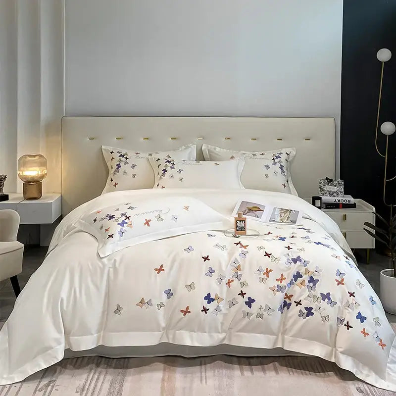 White cotton bedding set with delicate pastel butterfly embroidery for elegant bedroom decor by decorbites butterfly embroidery