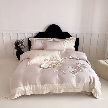 A blush pink satin bedding set with butterfly flowers embroidery and a cream ruffled hem for elegant decorbites decor