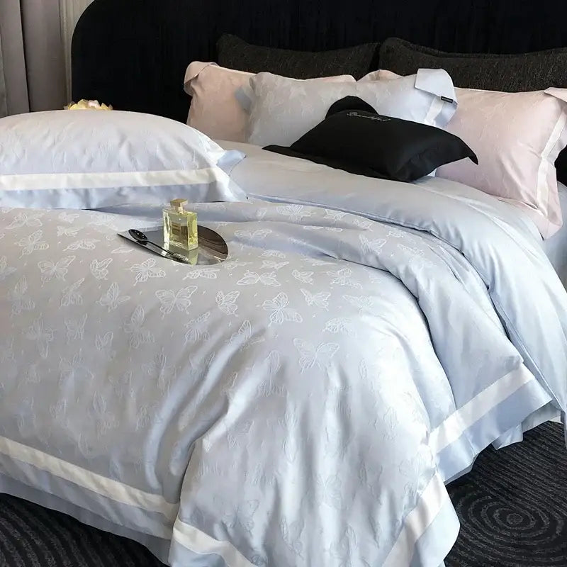 Light blue butterfly jacquard bedding set with white trim featuring a duvet cover from decorbites butterfly jacquard collection