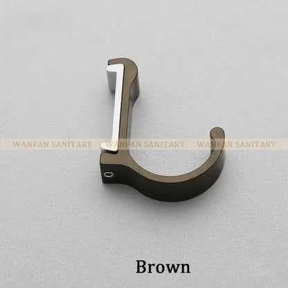 Brown candy color metal wall hook with sleek curved design and polished silver accent for bathroom towels and coats