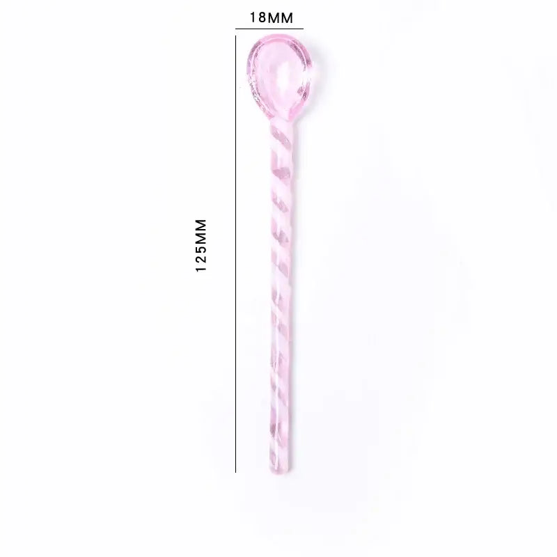 A translucent pink glass stirring spoon with a twisted handle measuring 125mm for decorbites colorful glass set