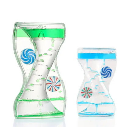 Clear glass liquid motion sand timer with swirling candy designs and vibrant blue and green liquids for living room decor