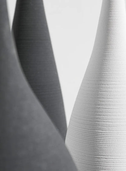 White ceramic capiron zen vase with vertical ribbed texture for nordic interior and living room decoration