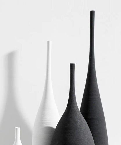 Minimalist CAPIRON zen ceramic vases in white and matte black with elongated necks for Nordic home decoration