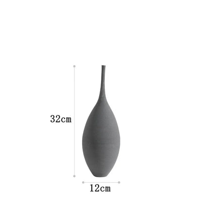 A sleek matte gray ceramic zen vase with a slender neck and rounded body for home decoration and flowerpot use