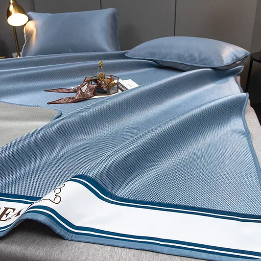 Light blue decorbites carbon light cooling mat and pillowcase set with textured weave and white navy striped border