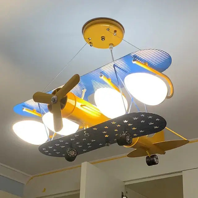 Yellow and blue cartoon aircraft ceiling fan with star-patterned wings for bedroom decorbites cartoon aircraft light fixture