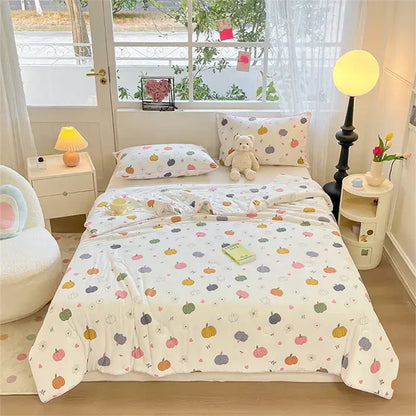 A cozy cream kids summer quilt with multicolored pumpkin and flower pattern from decorbites kids decorbites kids summer