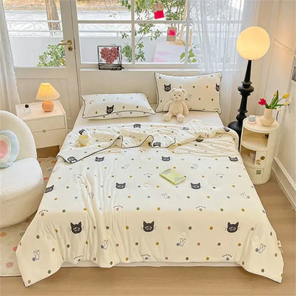 Cream-colored kids summer quilt with black and gray cartoon cats gold polka dots soft cotton fabric by decorbites kids