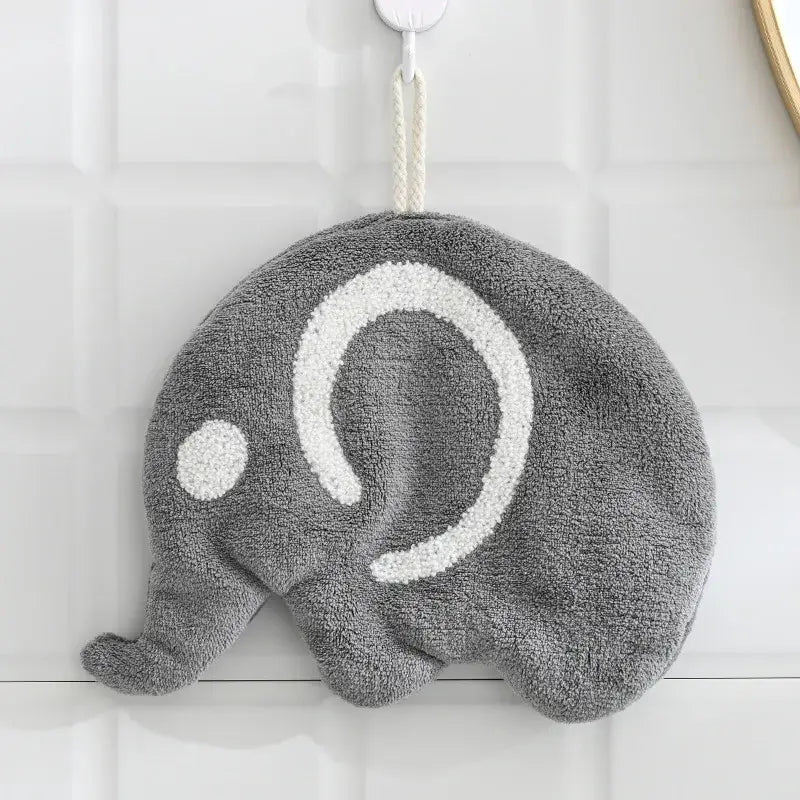 Gray plush elephant-shaped bath sponge with white embroidery paired with orange and gray decorbites cartoon animals coral hand towel